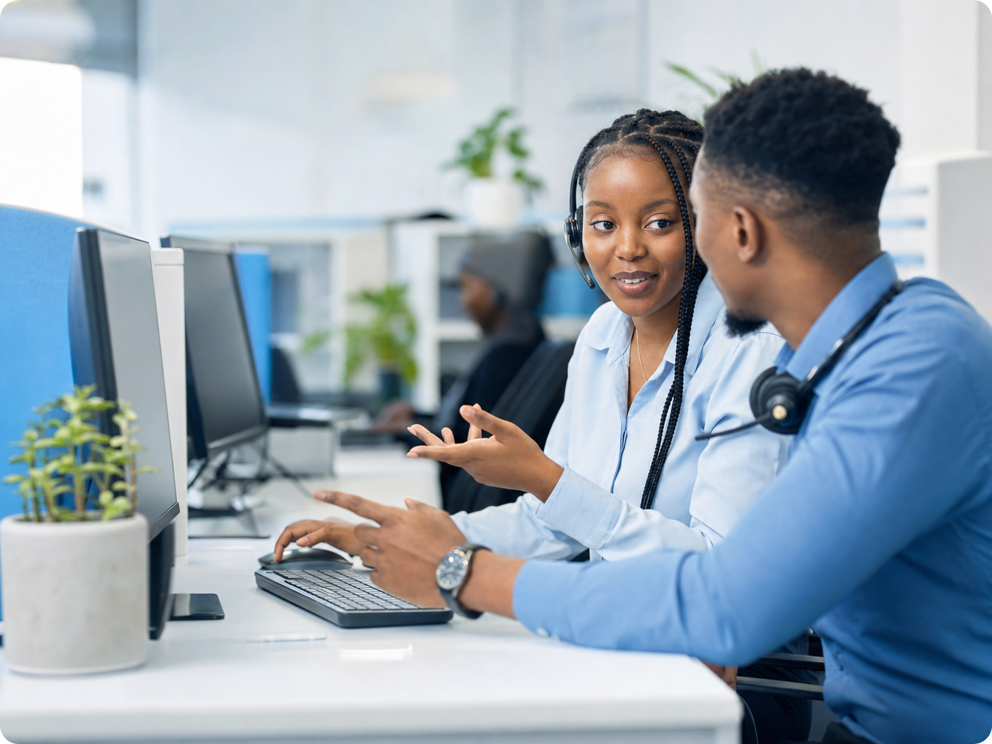Yatosha support specialists collaborating at their desks